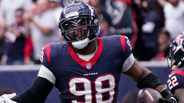 Houston Texans defensive tackle Sheldon Rankins (98) celebrates his touchdown off a ball fumbled by Tennessee Titans quarterback Will Levis during the second quarter at NRG Stadium in Houston, Texas., Sunday, Dec. 31, 2023.  